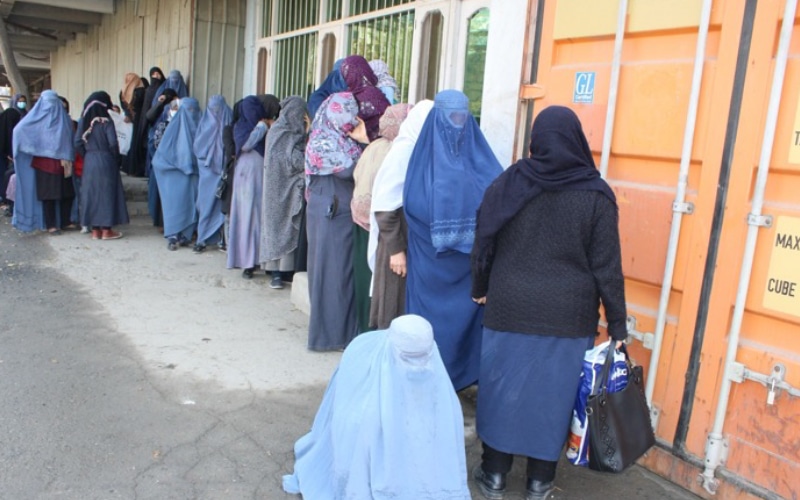 Women standing in line for supplies