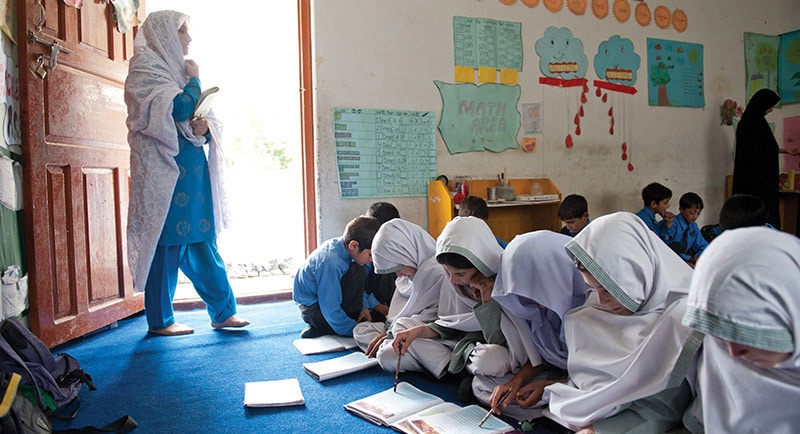 Teacher in classroom with students