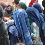 Women receiving aid packages
