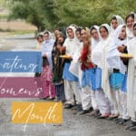 Group of women and girls in Pakistan waving