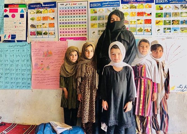 Teacher with students in classroom