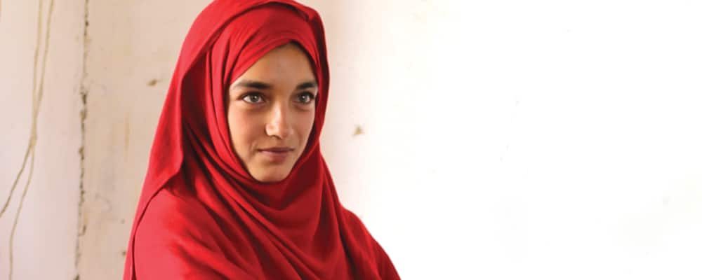 Afghan girl wearing red