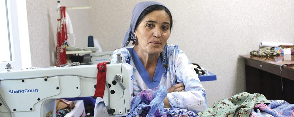 Woman in Tajikistan with sewing machine